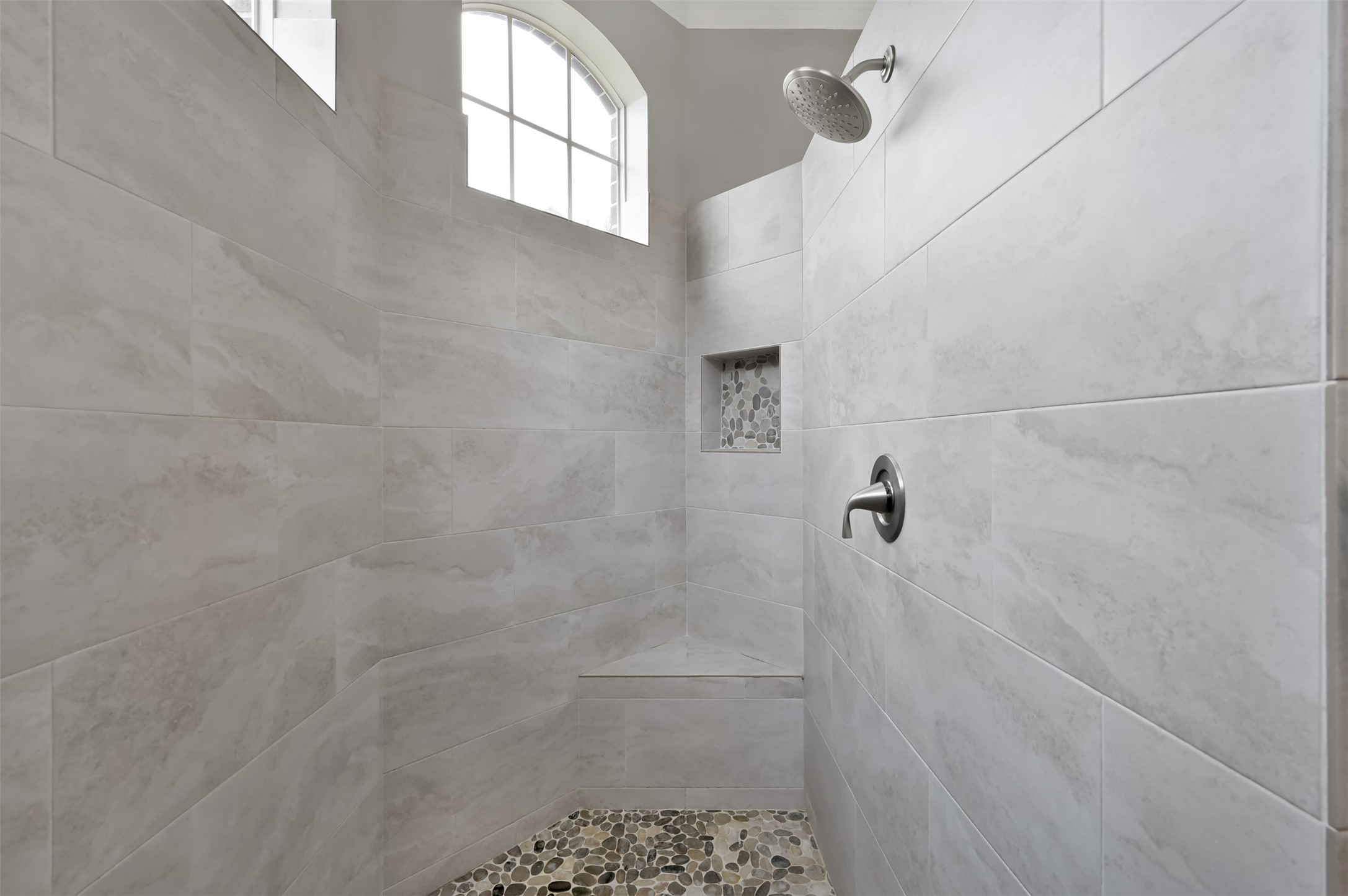 9706 Chipstead Court Spring, TX 77379 - Photo 27 of 44 Now for one of the best parts of this home, a HUGE walk in shower basking in natural light. It's the perfect way to start any day.