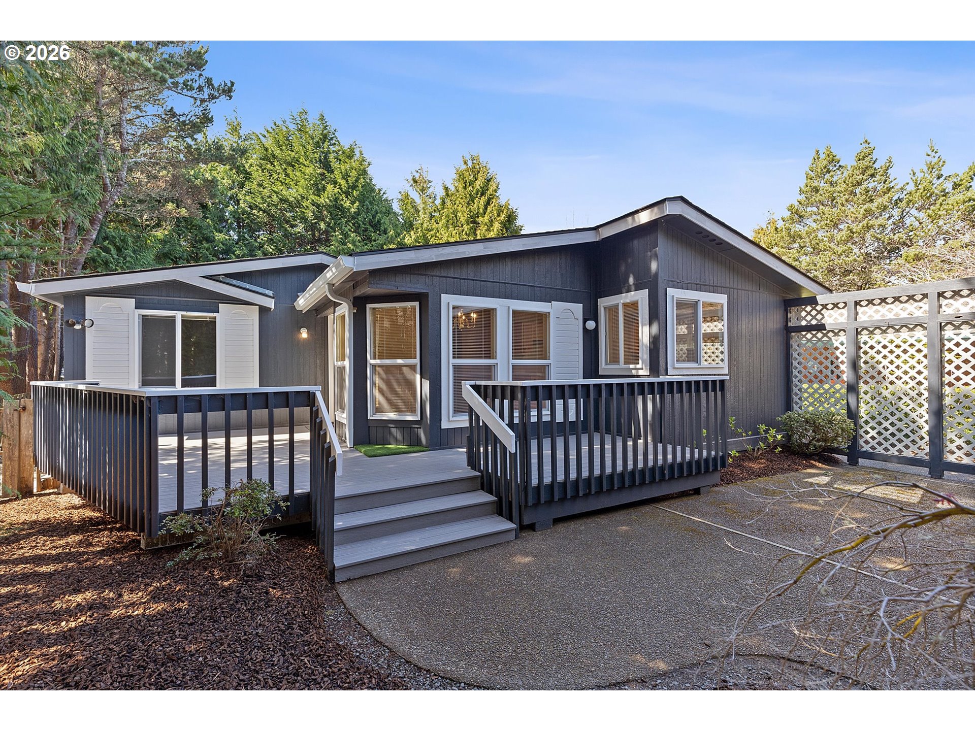 a view of a house with a wooden deck