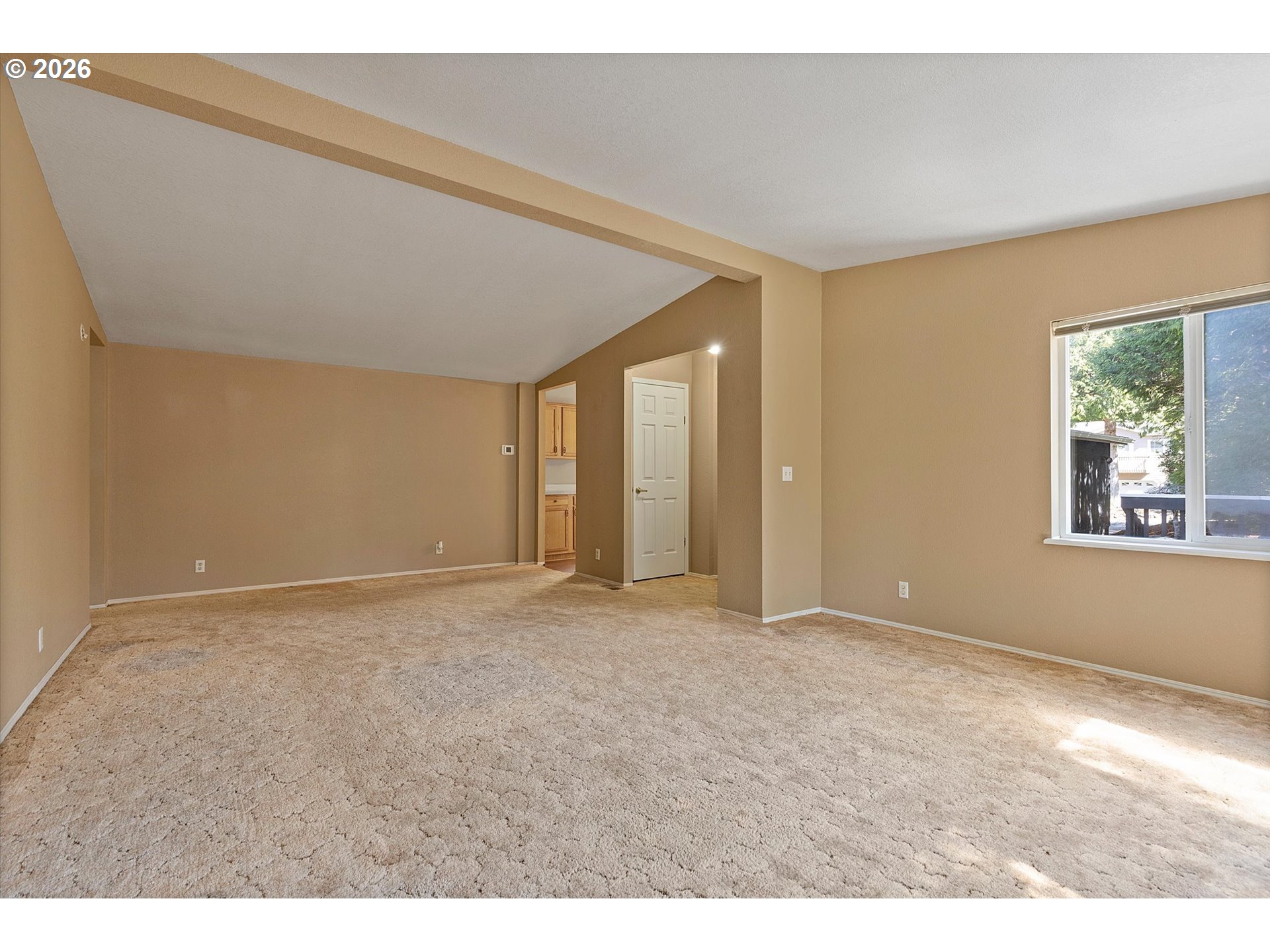 395 Seagrove Loop Lincoln City, OR 97367 - Photo 12 of 46 a view of an empty room with a window