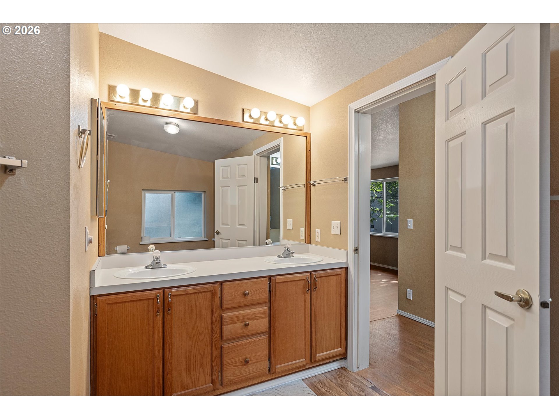 395 Seagrove Loop Lincoln City, OR 97367 - Photo 17 of 46 a bathroom with a sink a mirror and a shower