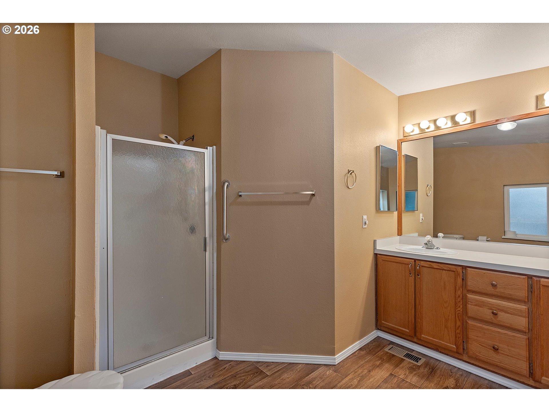 395 Seagrove Loop Lincoln City, OR 97367 - Photo 18 of 46 a bathroom with a sink and a mirror