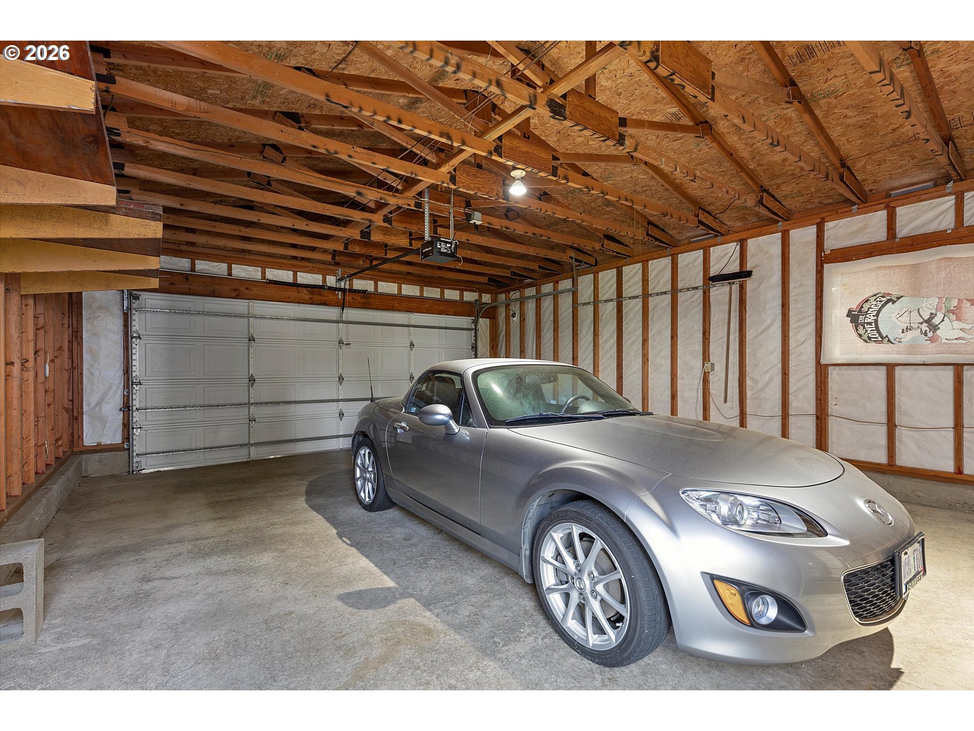395 Seagrove Loop Lincoln City, OR 97367 - Photo 27 of 46 a car parked in a garage