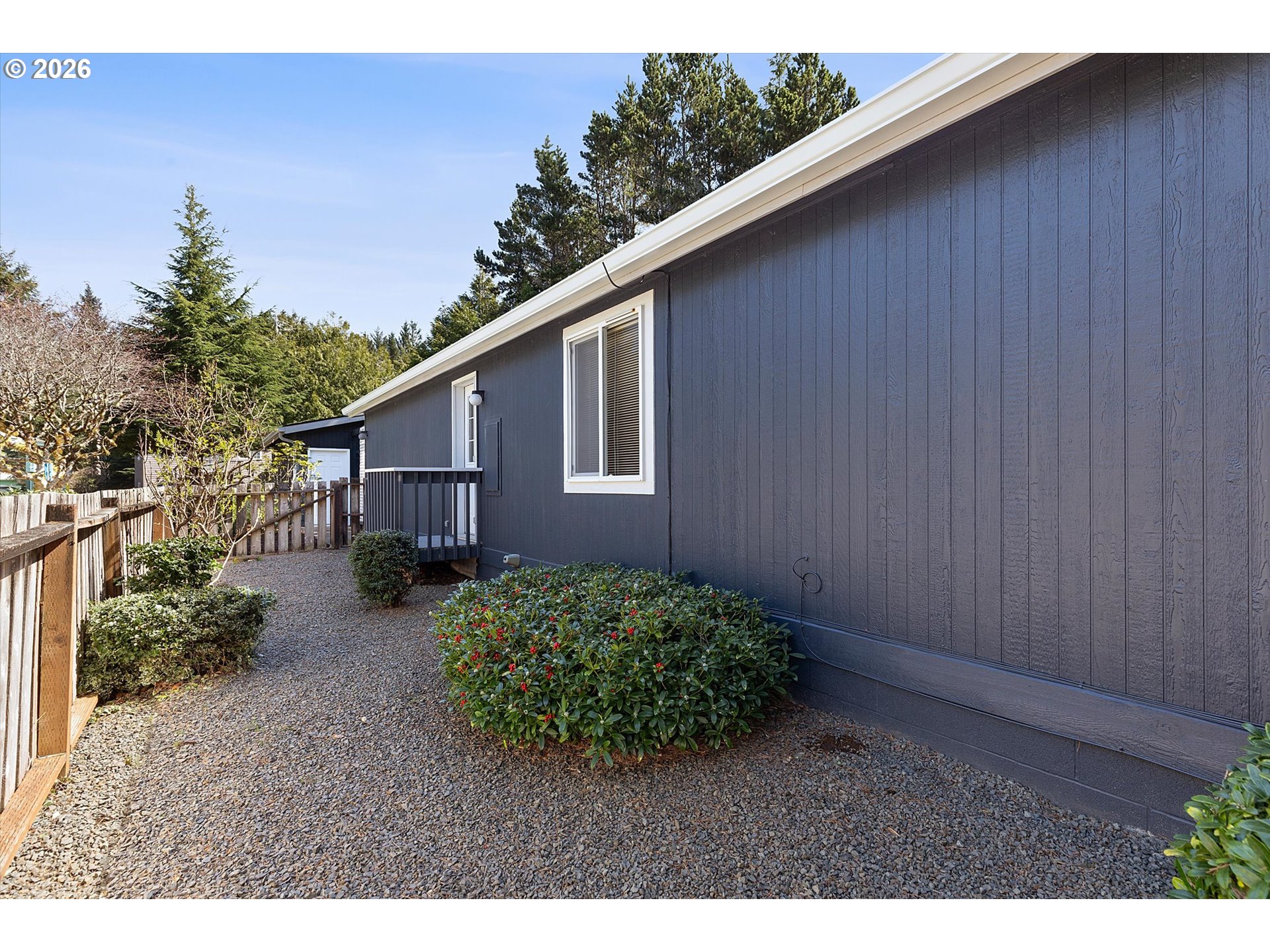 395 Seagrove Loop Lincoln City, OR 97367 - Photo 32 of 46 a backyard of a house with lots of green space