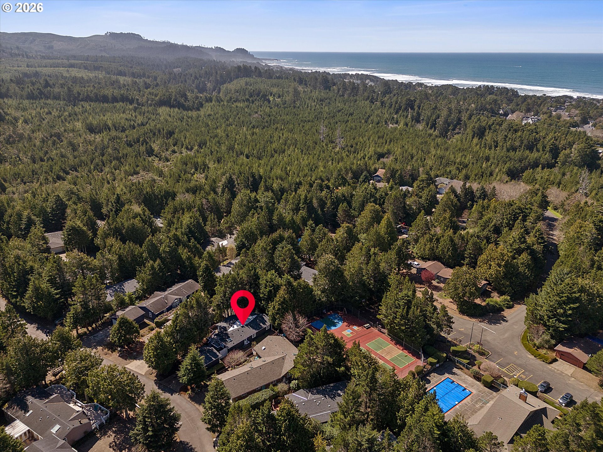 395 Seagrove Loop Lincoln City, OR 97367 - Photo 40 of 46 an aerial view of a houses with a street