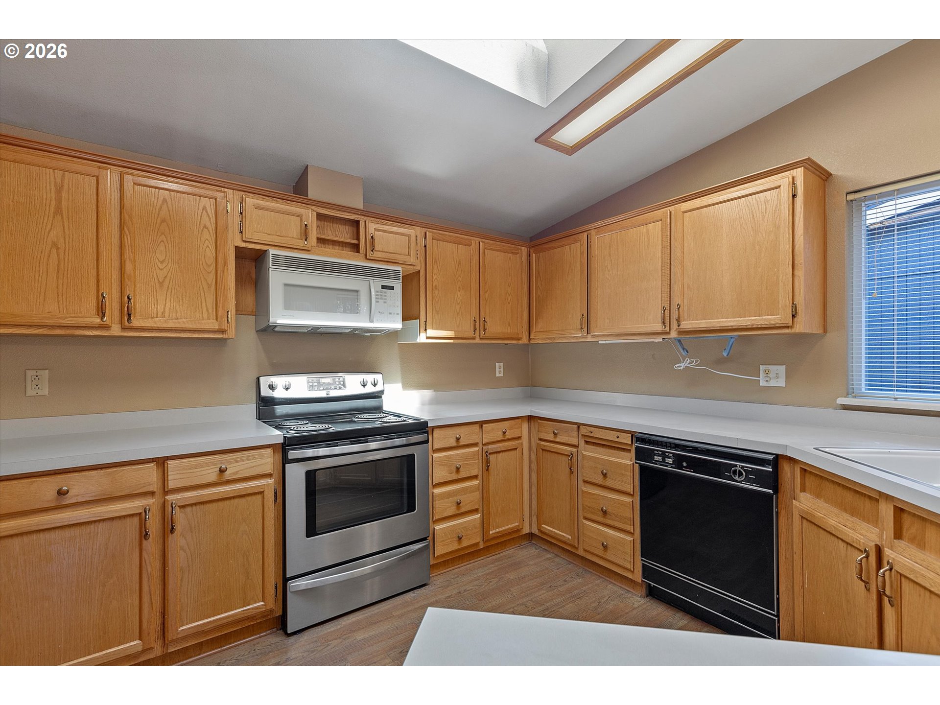 395 Seagrove Loop Lincoln City, OR 97367 - Photo 4 of 46 a kitchen with stainless steel appliances granite countertop a stove sink and cabinets