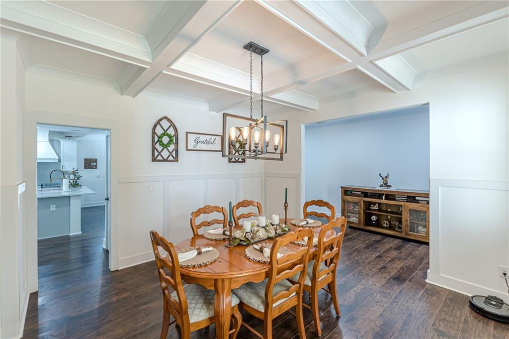 21 Lovell Road Temple, GA 30179 - Photo 11 of 77 a view of a dining room with furniture wooden floor and a chandelier