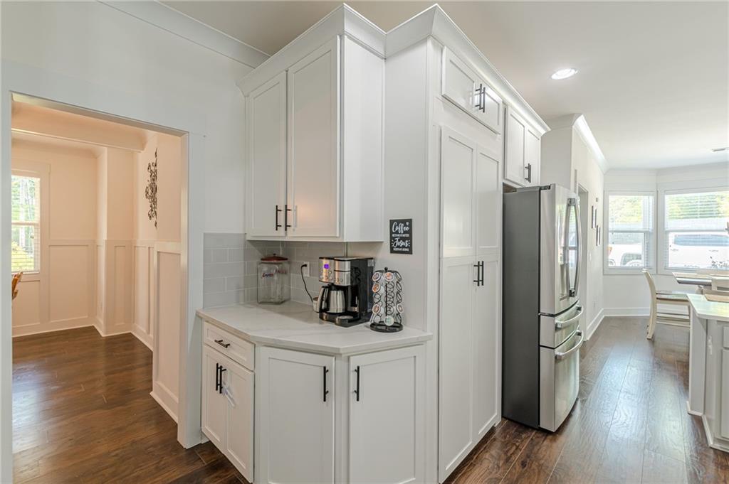 21 Lovell Road Temple, GA 30179 - Photo 12 of 77 a kitchen with stainless steel appliances a refrigerator and a hard wood floor
