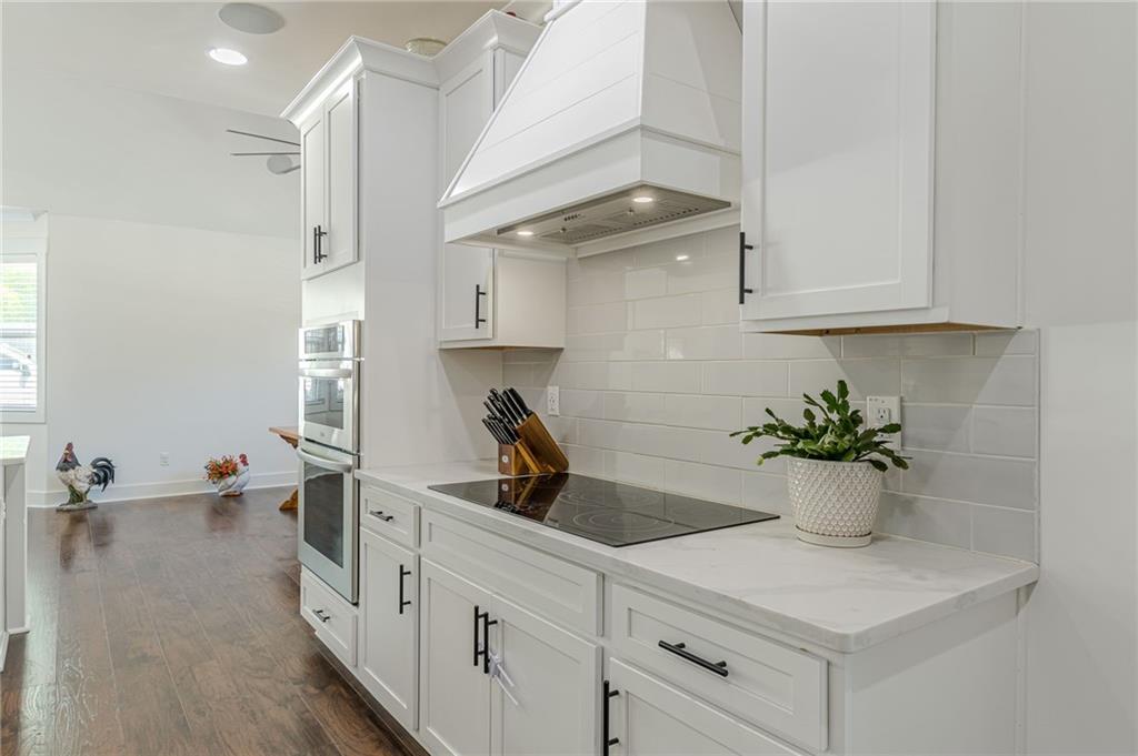 21 Lovell Road Temple, GA 30179 - Photo 16 of 77 a kitchen with a sink and a potted plant