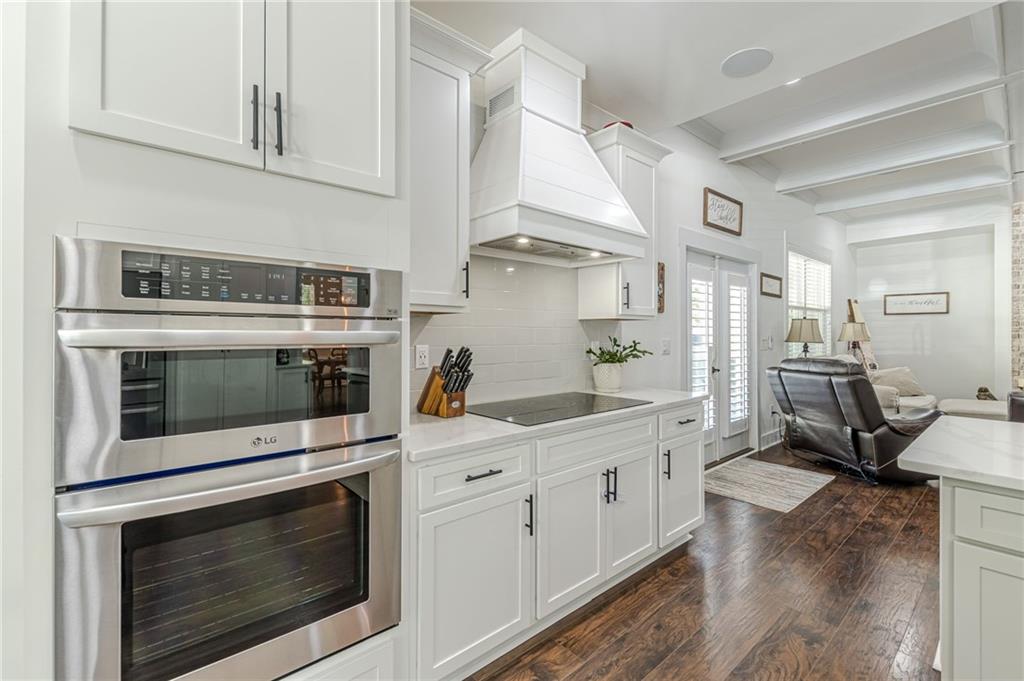 21 Lovell Road Temple, GA 30179 - Photo 17 of 77 a kitchen with stainless steel appliances white cabinets and a stove top oven