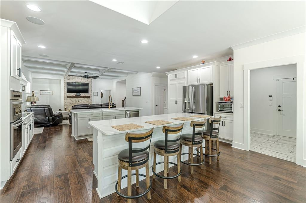 21 Lovell Road Temple, GA 30179 - Photo 21 of 77 a view of a dining room with furniture wooden floor and a chandelier