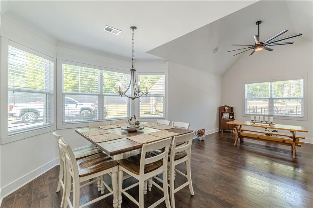 21 Lovell Road Temple, GA 30179 - Photo 25 of 77 a view of a dining room and livingroom with furniture wooden floor a chandelier