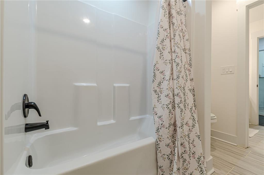 21 Lovell Road Temple, GA 30179 - Photo 51 of 77 a bathroom with a shower curtain and a sink