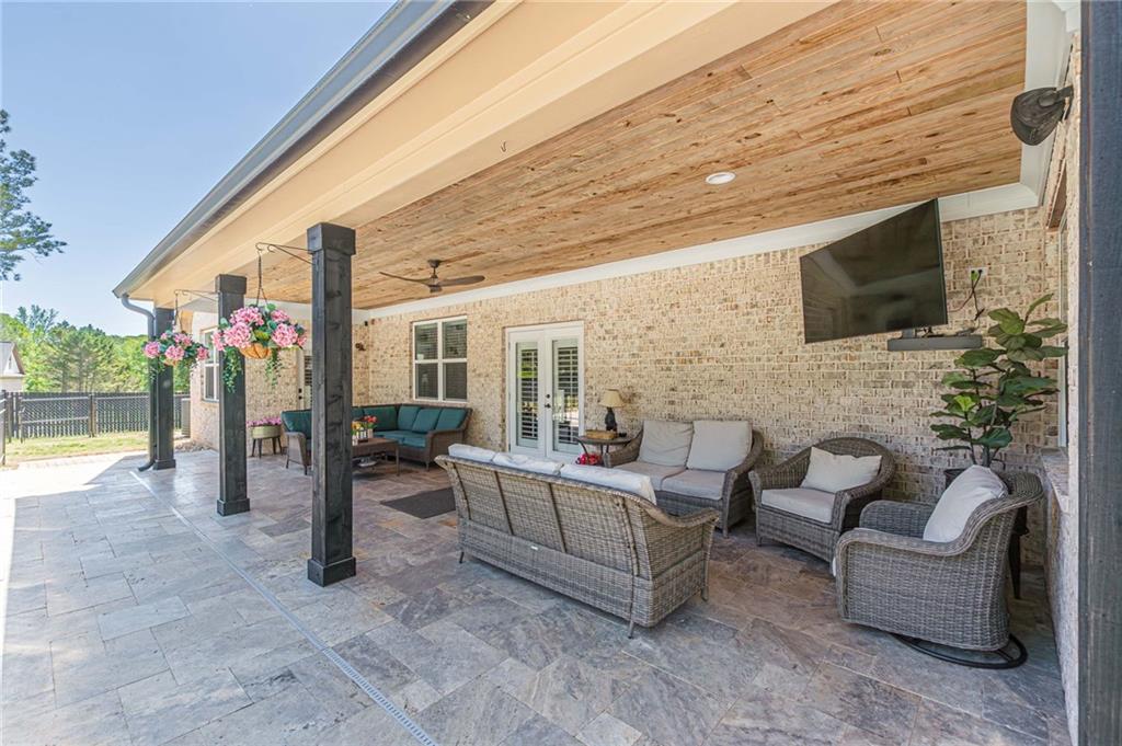 21 Lovell Road Temple, GA 30179 - Photo 56 of 77 a view of a patio with couches chairs and a large window