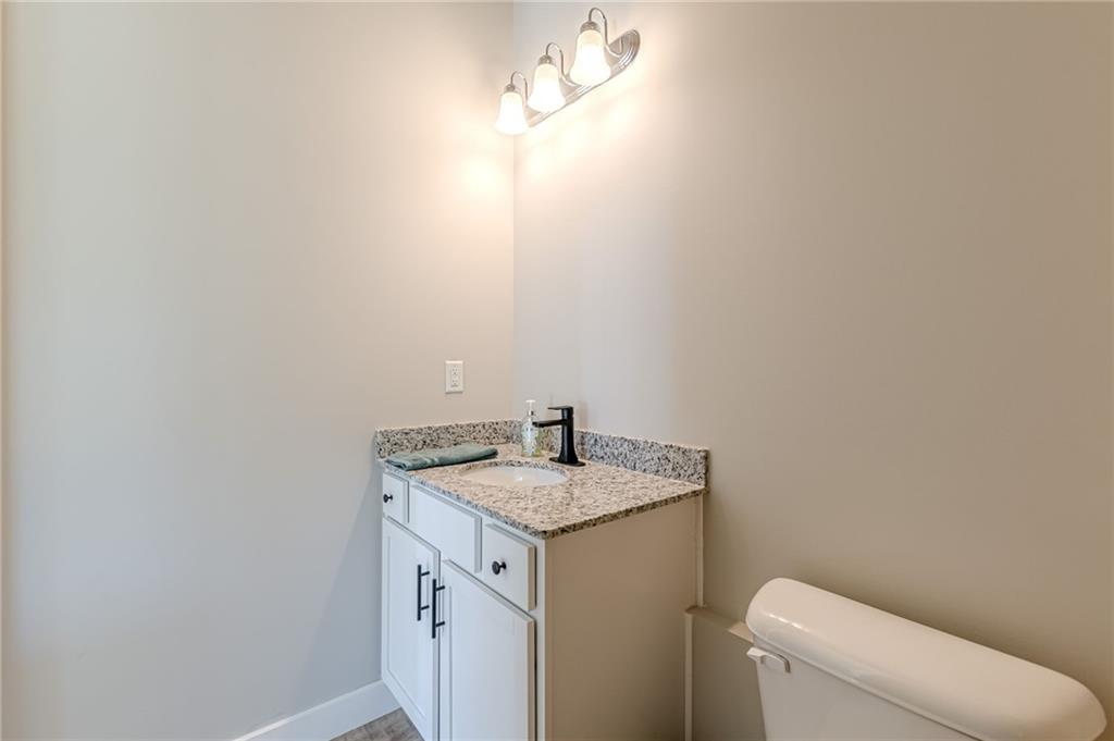 21 Lovell Road Temple, GA 30179 - Photo 62 of 77 a bathroom with a granite countertop sink and a toilet
