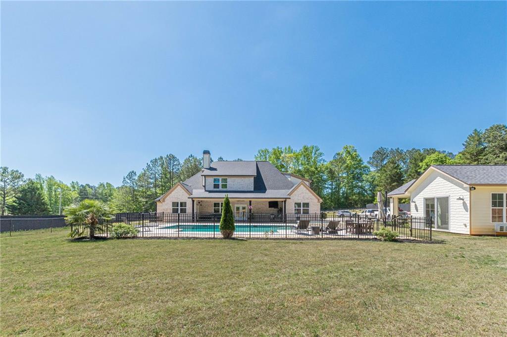 21 Lovell Road Temple, GA 30179 - Photo 69 of 77 a front view of house with outdoor space and trees in the background