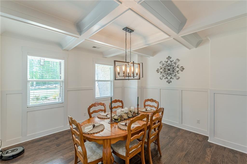 21 Lovell Road Temple, GA 30179 - Photo 9 of 77 a dining room with furniture a chandelier and wooden floor