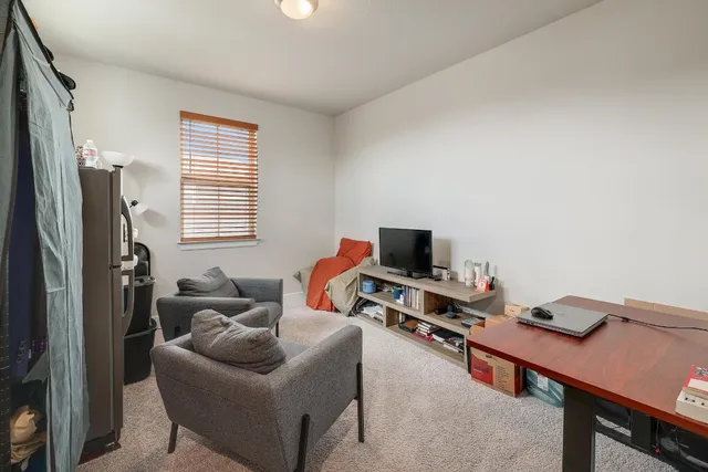 a workspace with furniture and a window