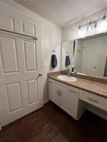 a bedroom with a bed and dresser