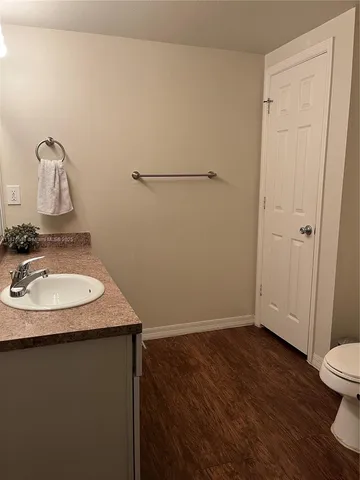 a view of a balcony with a table and chairs