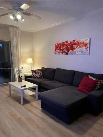 a bed room with furniture and flat screen tv