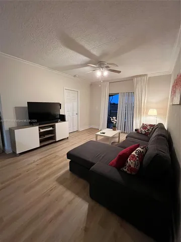 a living room with furniture and window