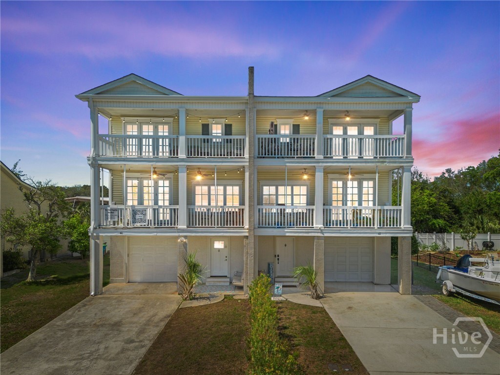 40 Captains View Tybee Island, GA 31328 - Photo 1 of 64 Night view of front of house