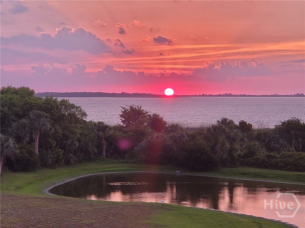 40 Captains View Tybee Island, GA 31328 - Photo 48 of 64 Sunset view from private boardwalk of lagoon and ocean