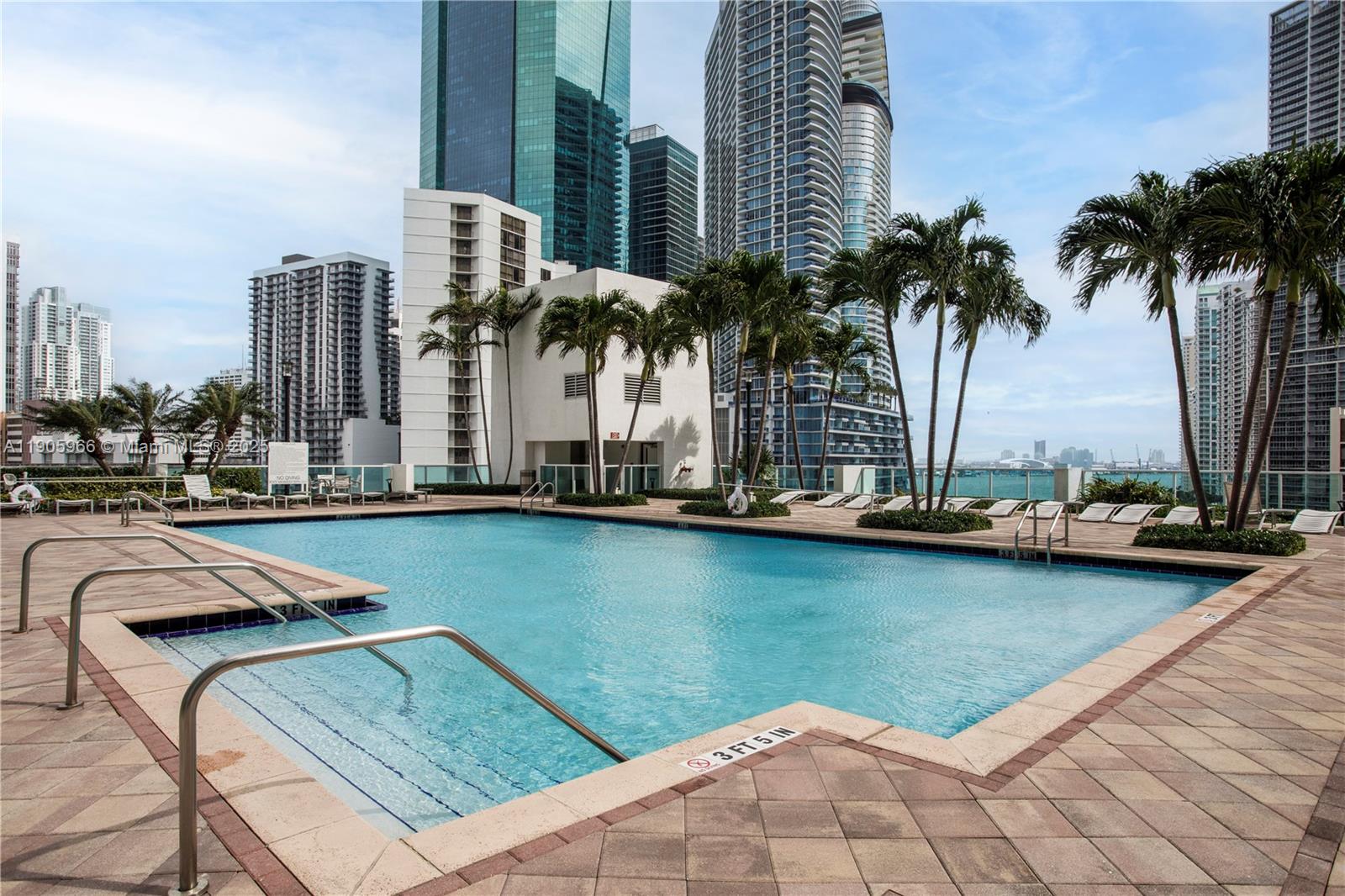 31 Southeast 5th Street, Unit 4018 Miami, FL 33131 - Photo 21 of 23 a view of outdoor space with swimming pool and seating