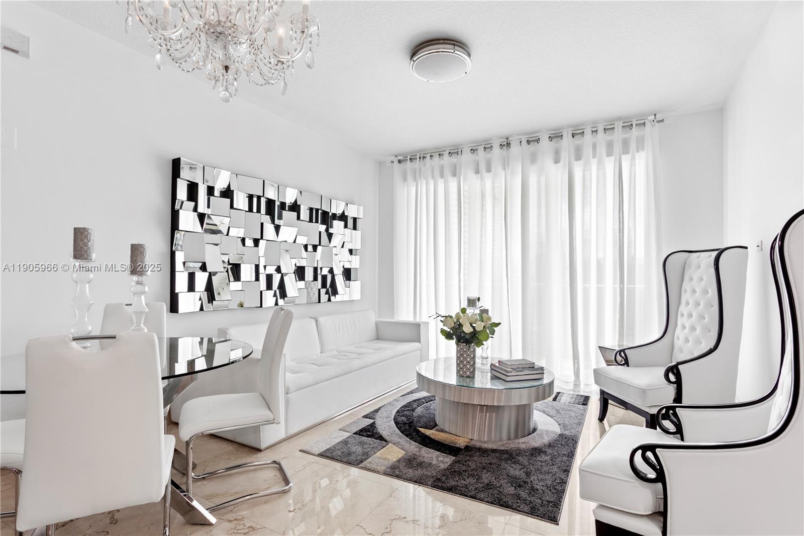 31 Southeast 5th Street, Unit 4018 Miami, FL 33131 - Photo 5 of 23 a living room with furniture and a large window