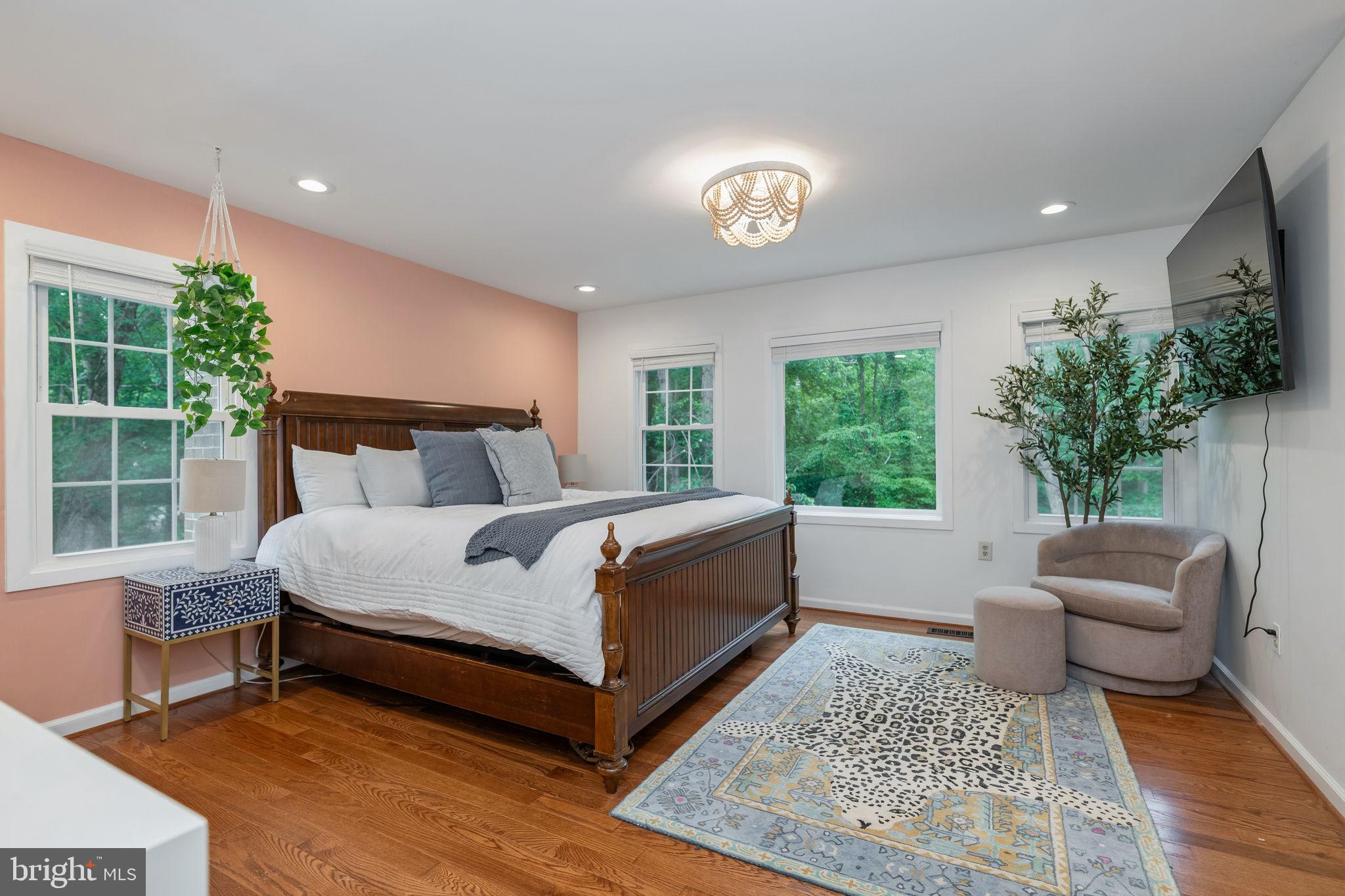 7603 Modisto Lane Springfield, VA 22153 - Photo 22 of 57 a bed sitting in a spacious bedroom next to a window
