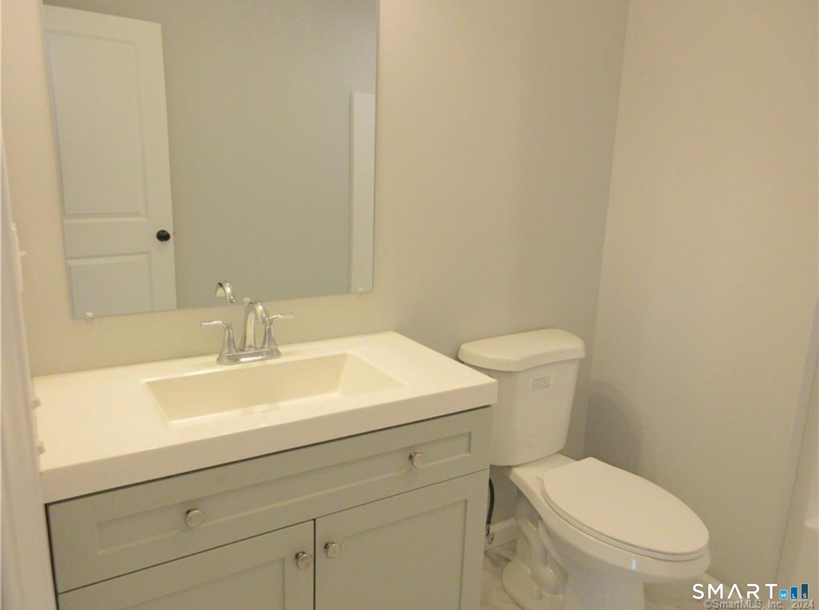249 South Canterbury Road Canterbury, CT 06331 - Photo 12 of 20 a bathroom with a sink a toilet and a mirror