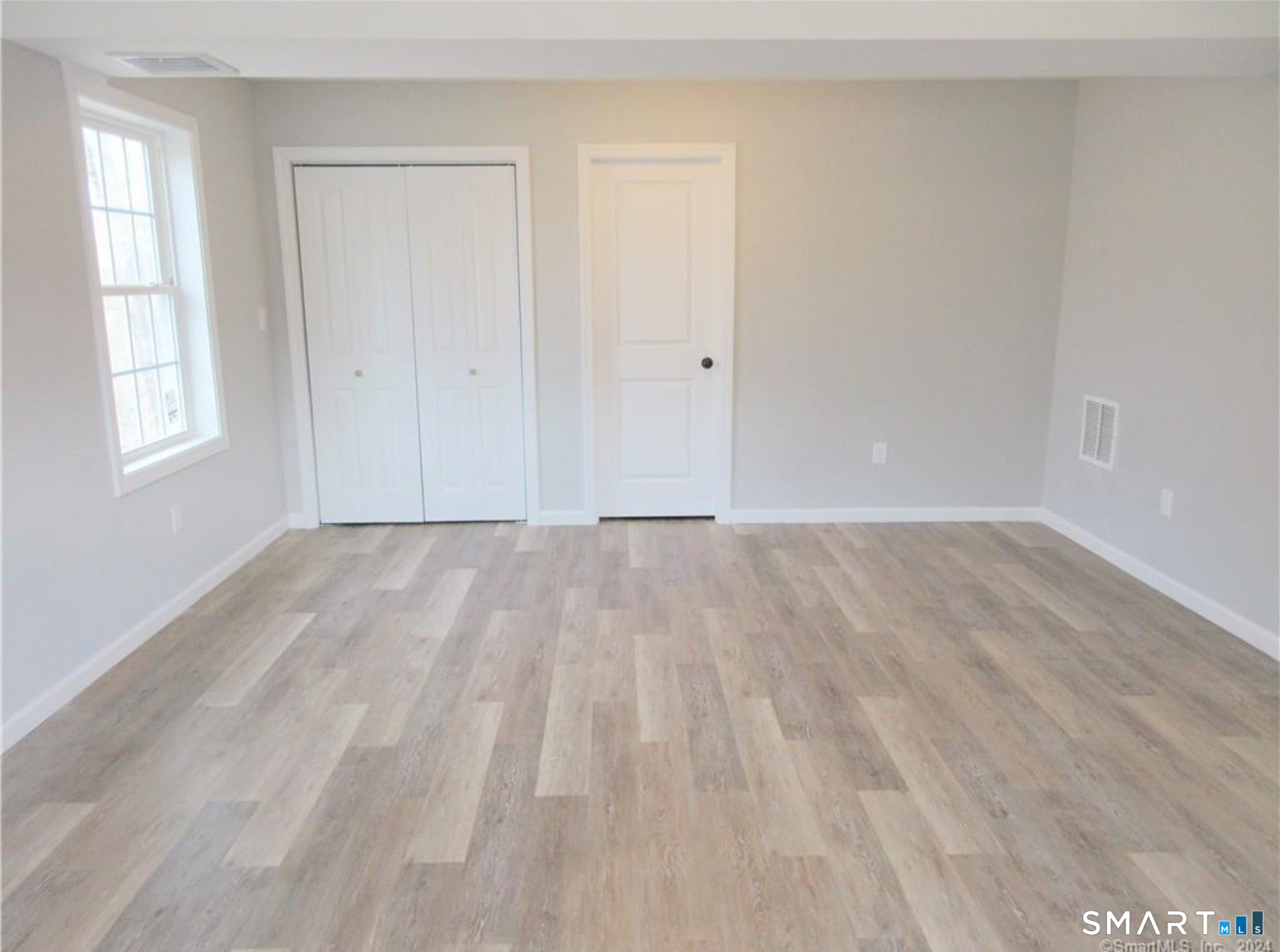 249 South Canterbury Road Canterbury, CT 06331 - Photo 14 of 20 a view of room with window and hardwood floor