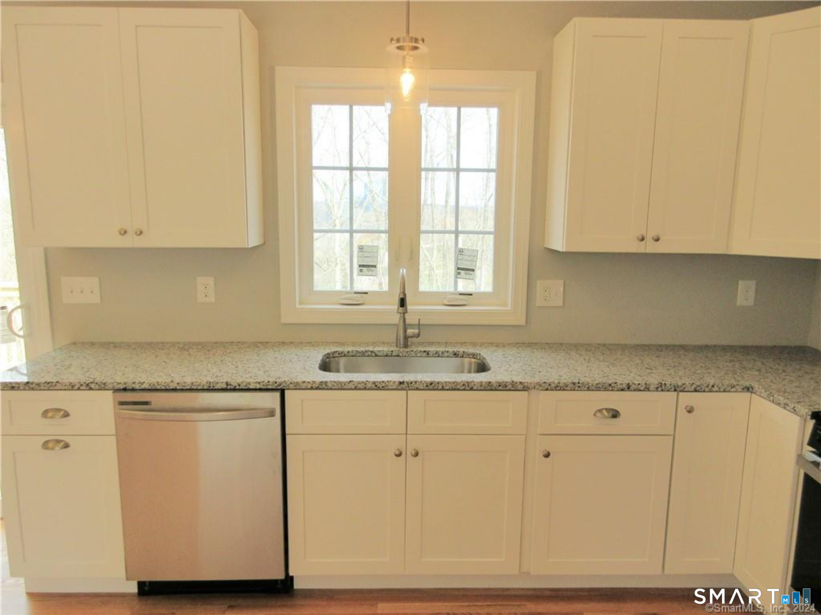 249 South Canterbury Road Canterbury, CT 06331 - Photo 9 of 20 a kitchen with granite countertop cabinets and window
