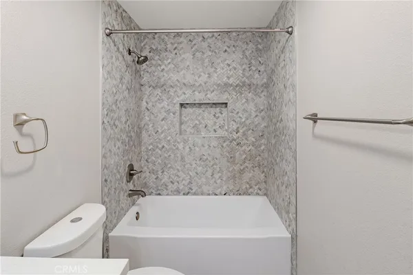 a bathroom with a shower and a toilet