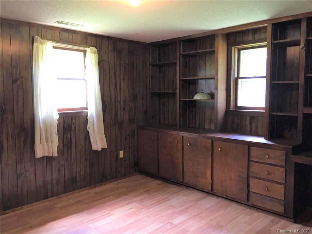 1920 Rock Road Rutherfordton, NC 28139 - Photo 27 of 48 a kitchen with a sink window and cabinets