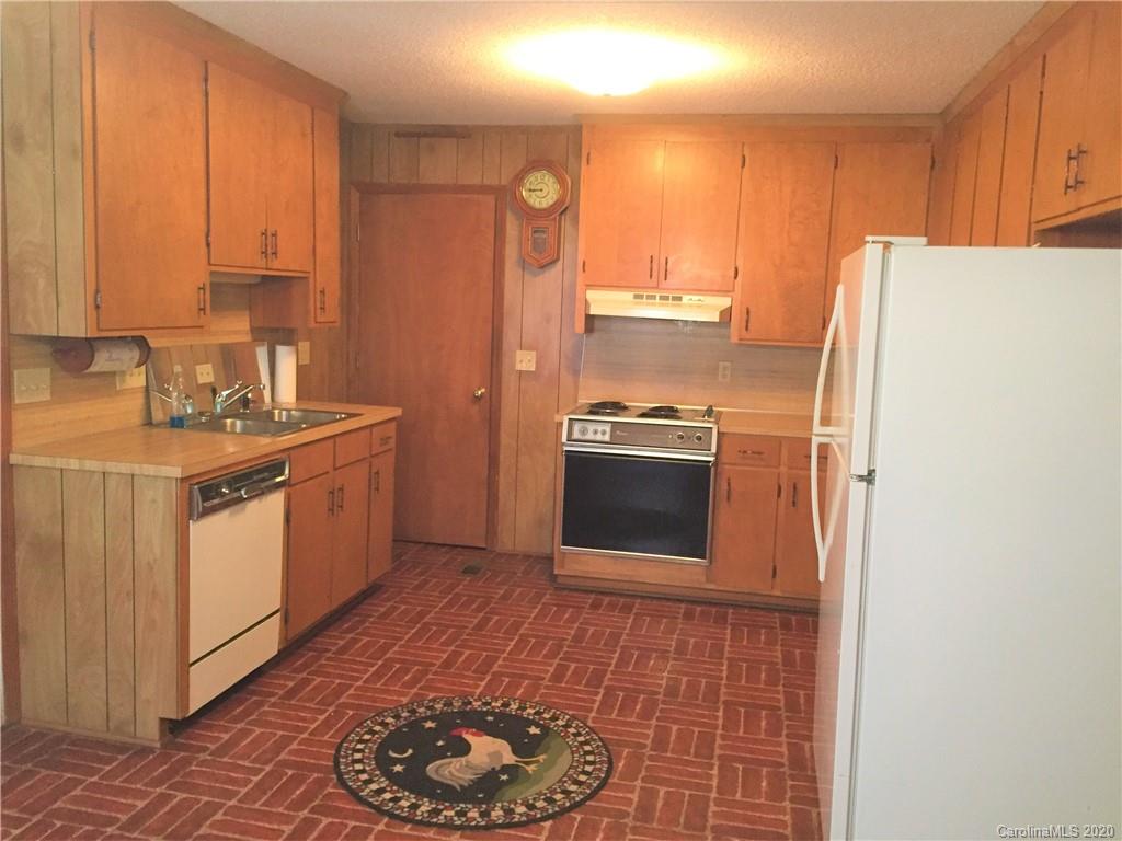 1920 Rock Road Rutherfordton, NC 28139 - Photo 7 of 48 a kitchen with stainless steel appliances granite countertop a refrigerator a stove and a sink