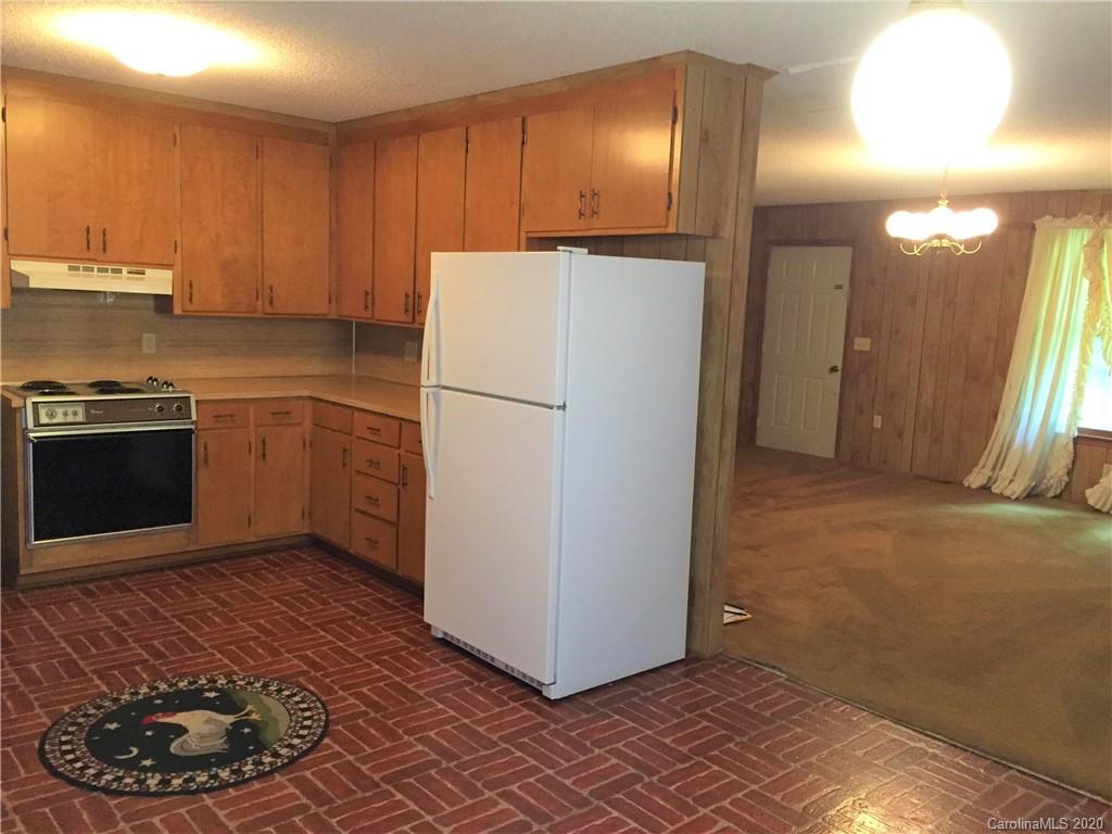 1920 Rock Road Rutherfordton, NC 28139 - Photo 8 of 48 a kitchen with a refrigerator and a stove