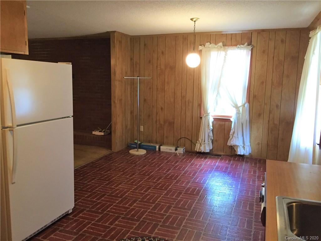 1920 Rock Road Rutherfordton, NC 28139 - Photo 10 of 48 a view of empty room with wooden floor and fan