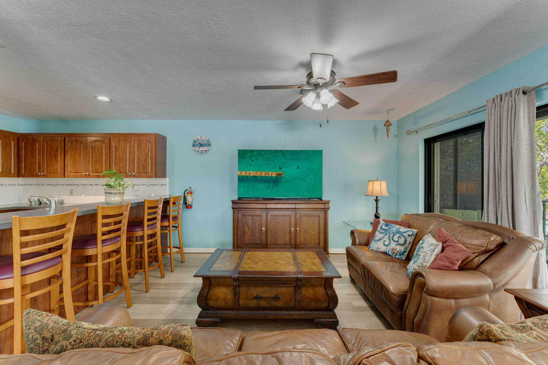 391 10th Street Key Colony Beach, FL 33051 - Photo 18 of 51 a living room with furniture kitchen view and a large window