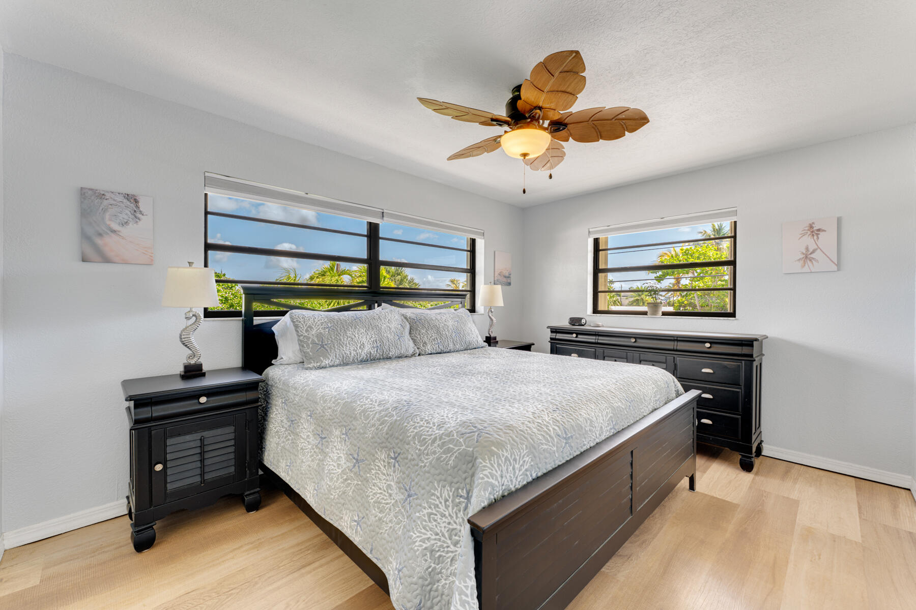 391 10th Street Key Colony Beach, FL 33051 - Photo 23 of 51 a bedroom with a bed and a chandelier