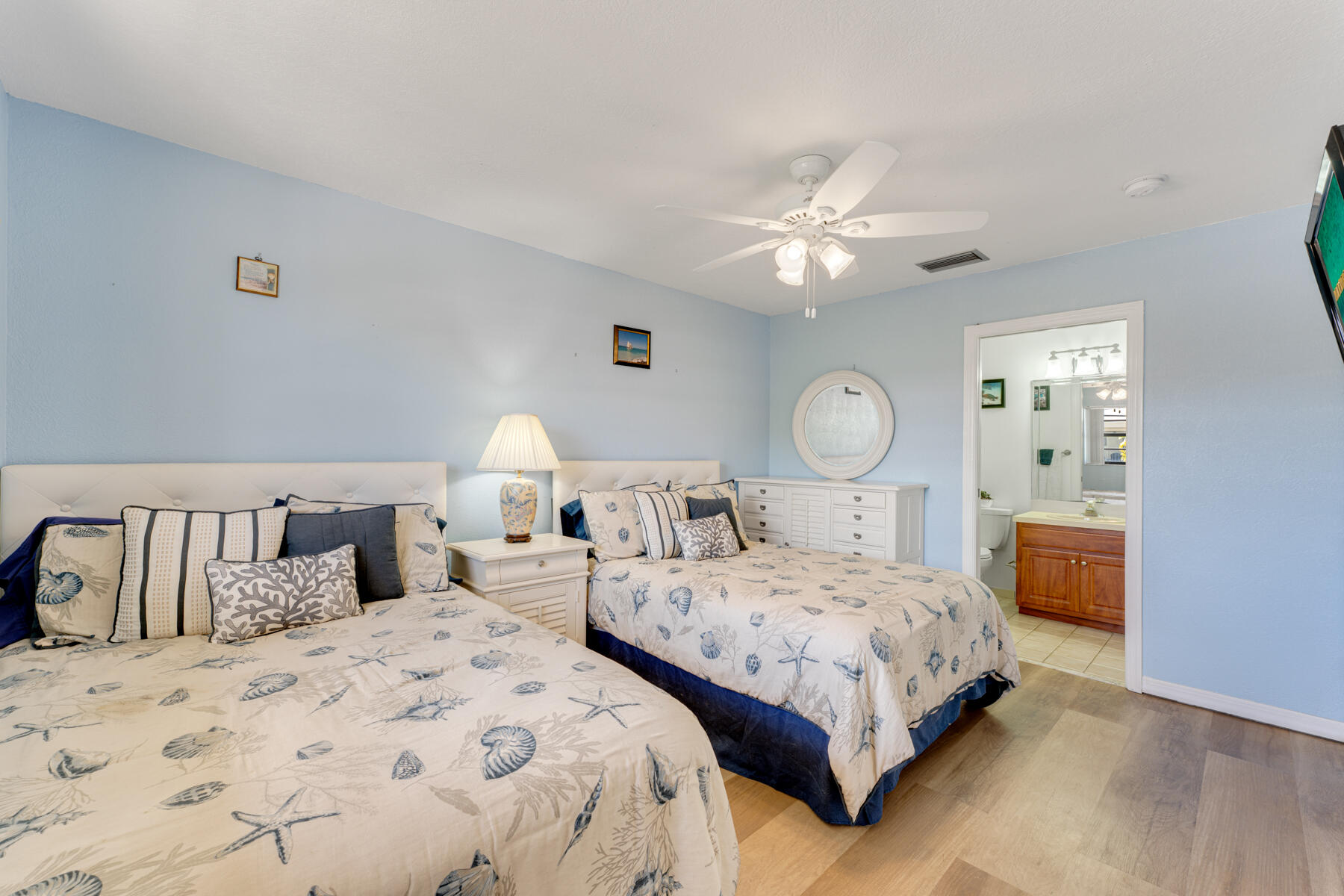 391 10th Street Key Colony Beach, FL 33051 - Photo 28 of 51 a bedroom with bed and a chandelier