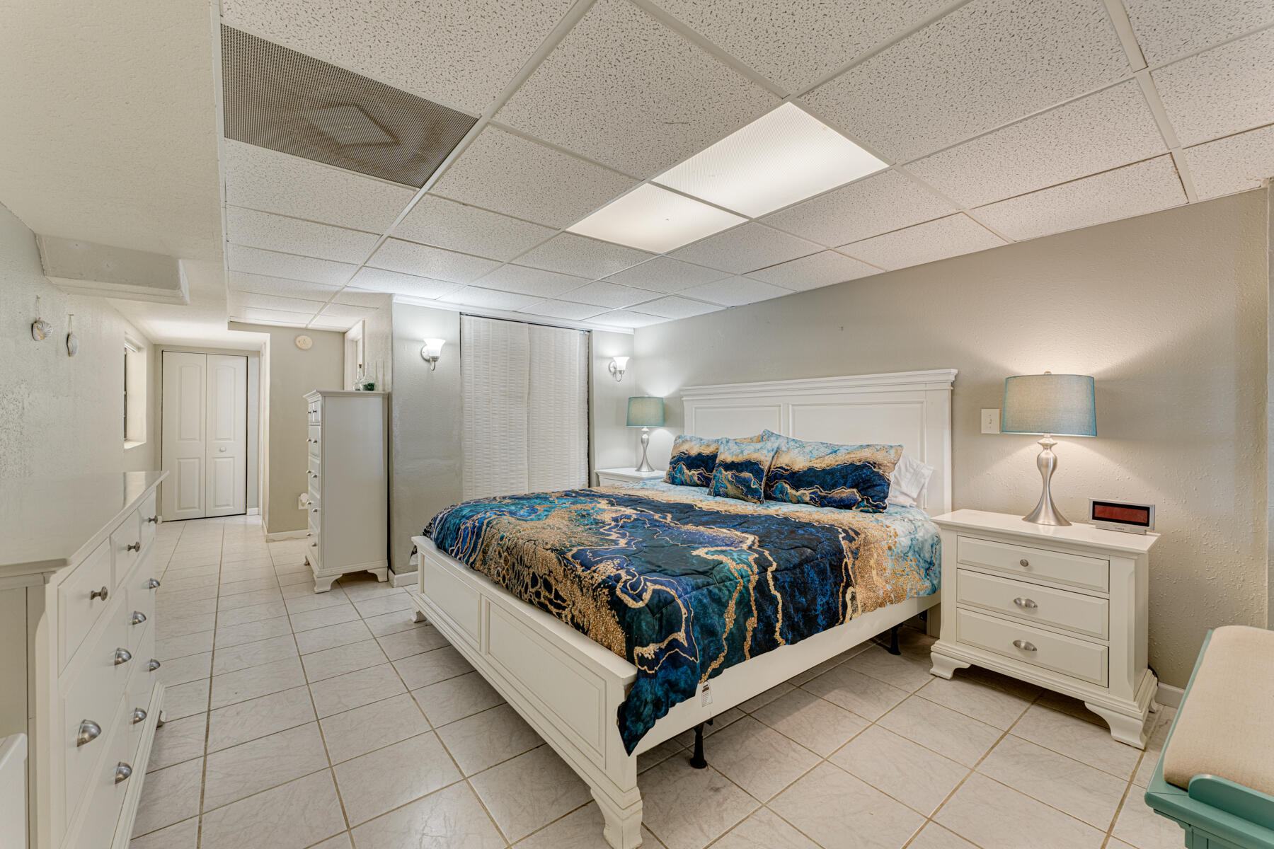 391 10th Street Key Colony Beach, FL 33051 - Photo 37 of 51 a spacious bedroom with a bed and a cabinets