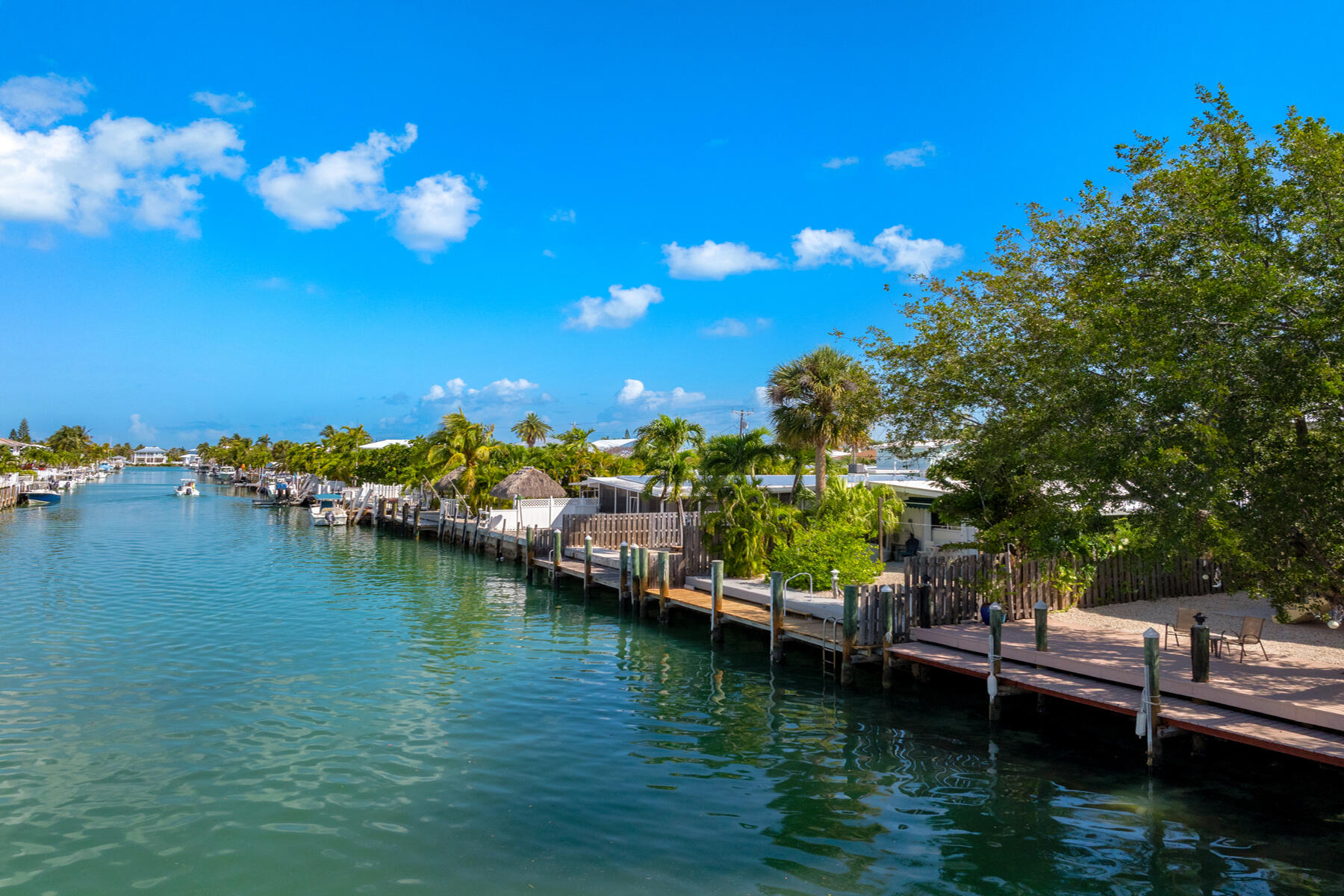 391 10th Street Key Colony Beach, FL 33051 - Photo 45 of 51 a view of an ocean with boats and trees in the background