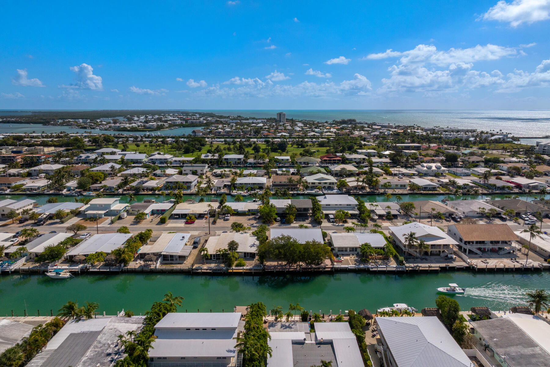 391 10th Street Key Colony Beach, FL 33051 - Photo 49 of 51 an aerial view of a city with lots of residential buildings ocean and mountain view in back
