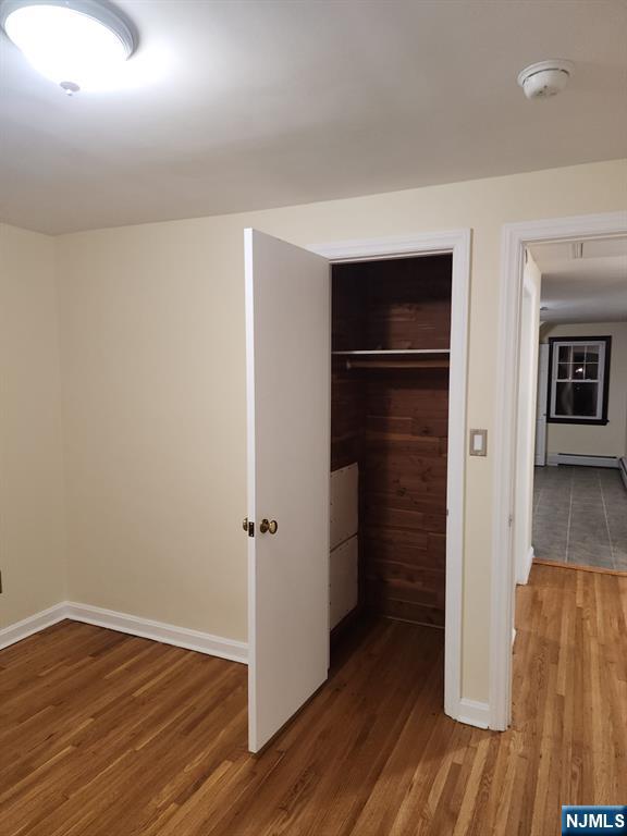 500 Weart Avenue, Unit 2 Lyndhurst, NJ 07071 - Photo 11 of 20 wooden floor in an empty room