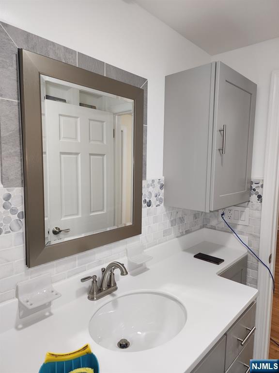 500 Weart Avenue, Unit 2 Lyndhurst, NJ 07071 - Photo 12 of 20 a bathroom with a sink and a mirror