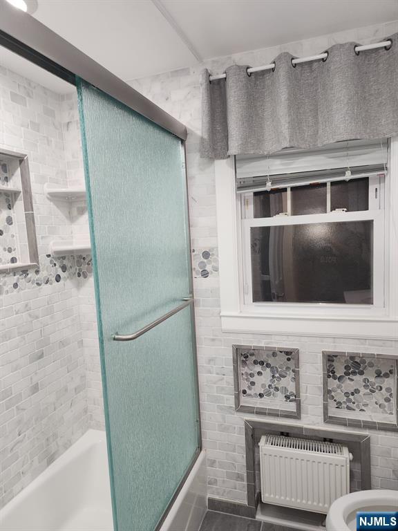 500 Weart Avenue, Unit 2 Lyndhurst, NJ 07071 - Photo 16 of 20 a bathroom with a tub and a shower