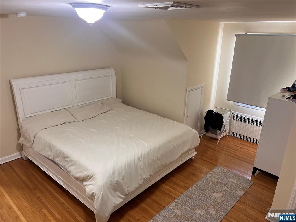 500 Weart Avenue, Unit 2 Lyndhurst, NJ 07071 - Photo 20 of 20 a bedroom with a bed and wooden floor
