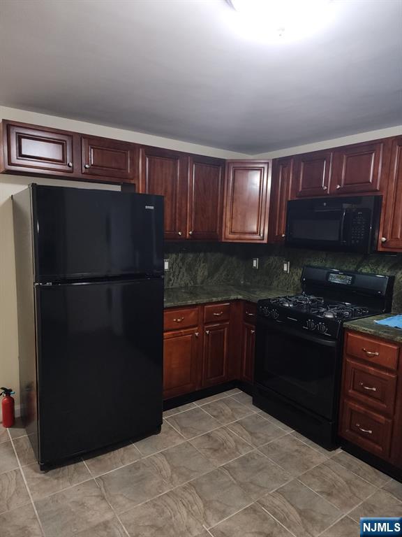 500 Weart Avenue, Unit 2 Lyndhurst, NJ 07071 - Photo 9 of 20 a kitchen with a refrigerator and a stove