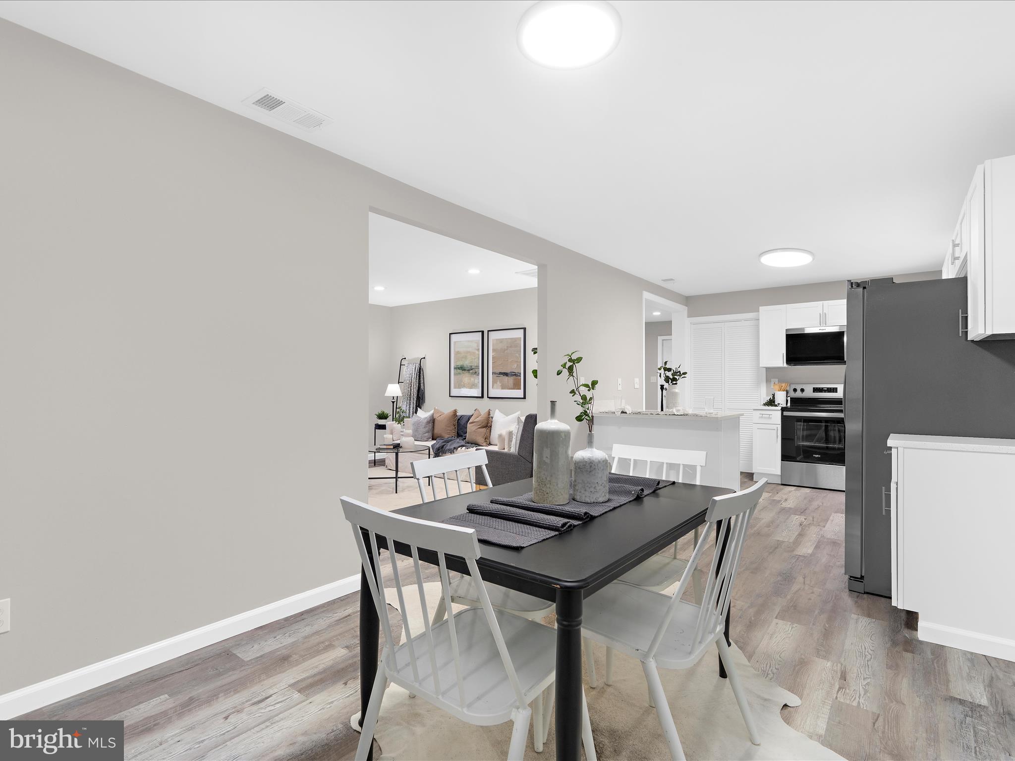 813 Ferguson Road Joppa, MD 21085 - Photo 12 of 39 a dining room with furniture and wooden floor